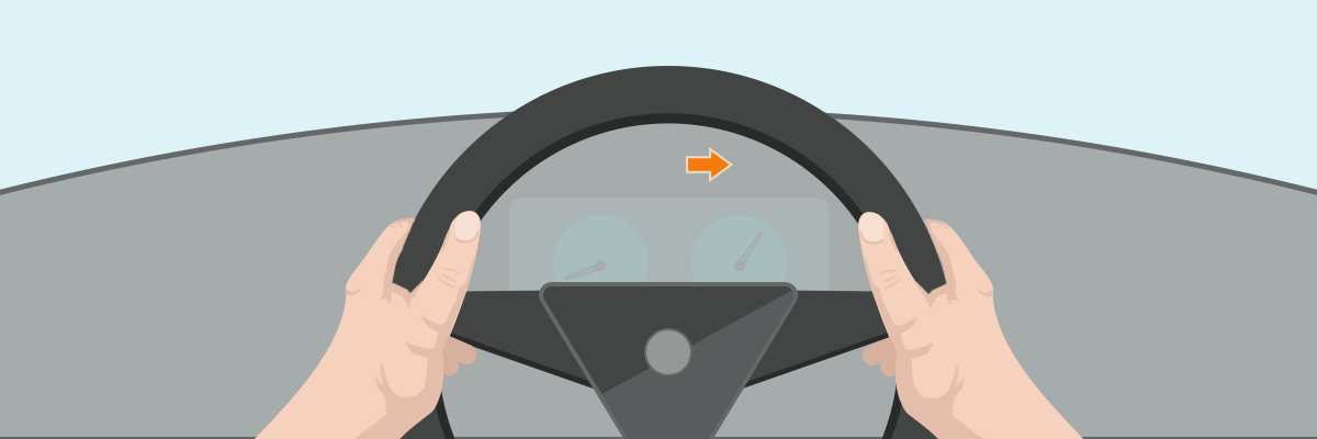 Hands on steering wheel with an indicator light on the dash