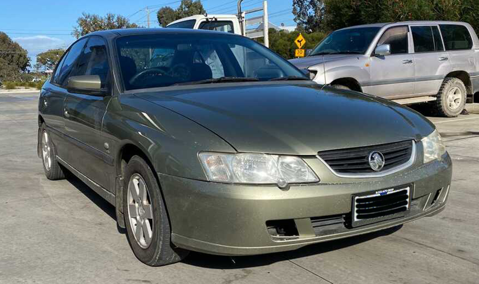 Photo of a gold 2003 Holden Commodore