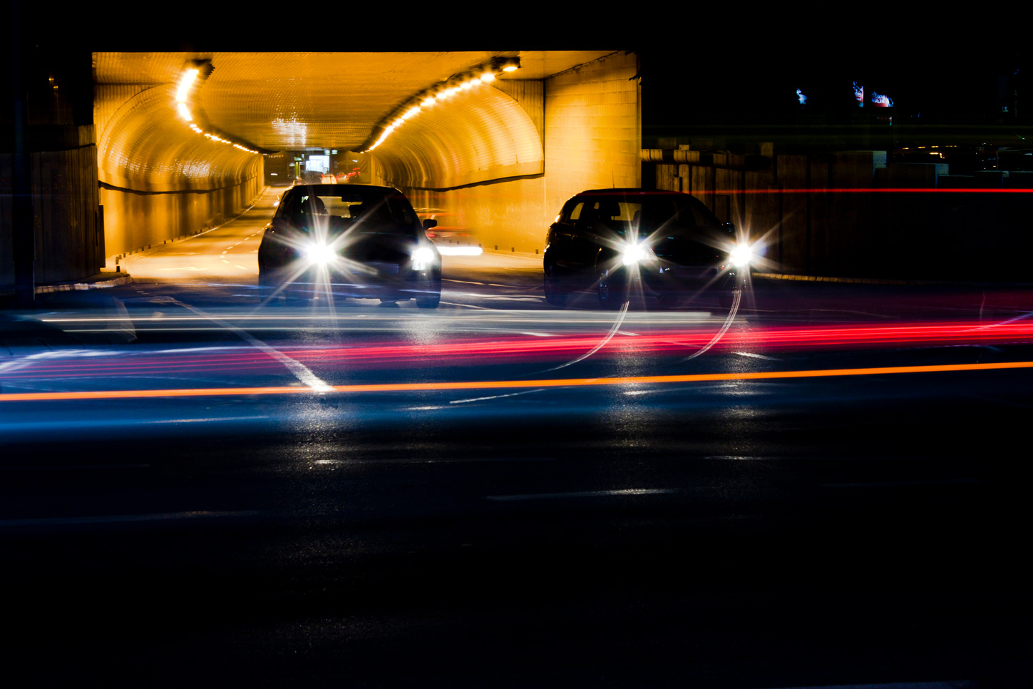 Cars at night in a tunnel