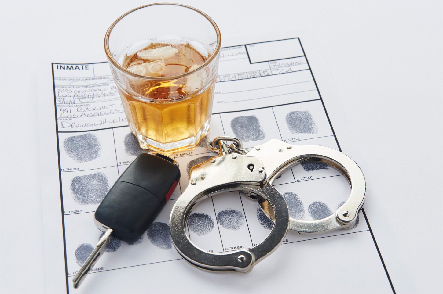 Car keys, drink and handcuffs