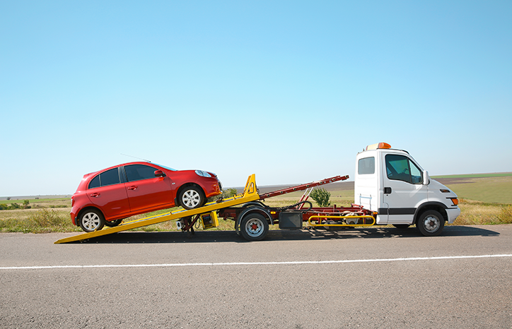 Photo of a car being collected by a recovery vehicle