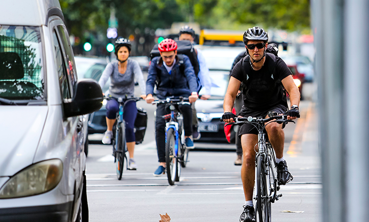 People cycling through a city