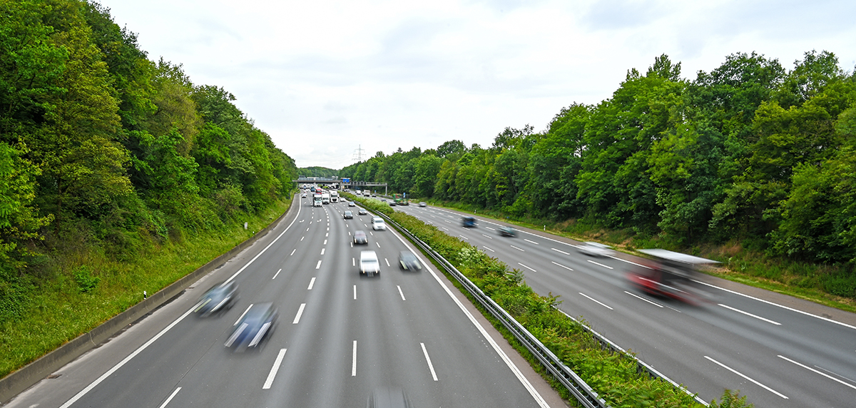 Blurred photo of cars spaced out on a motorway - Giving everyone room