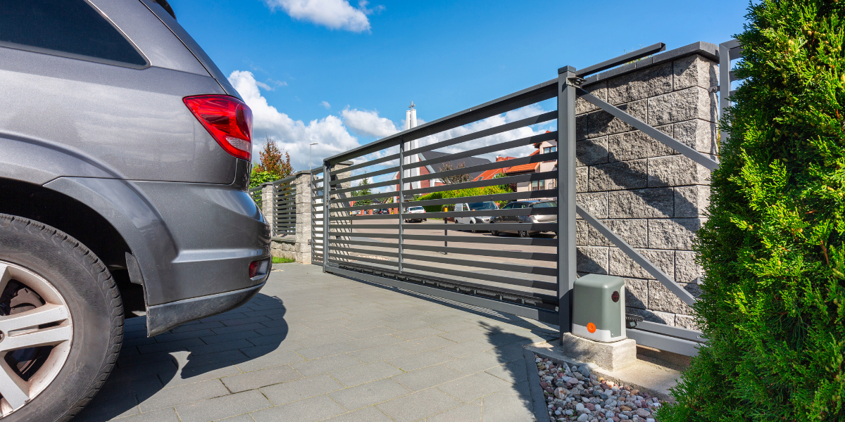 Car parked on private driveway behind gate