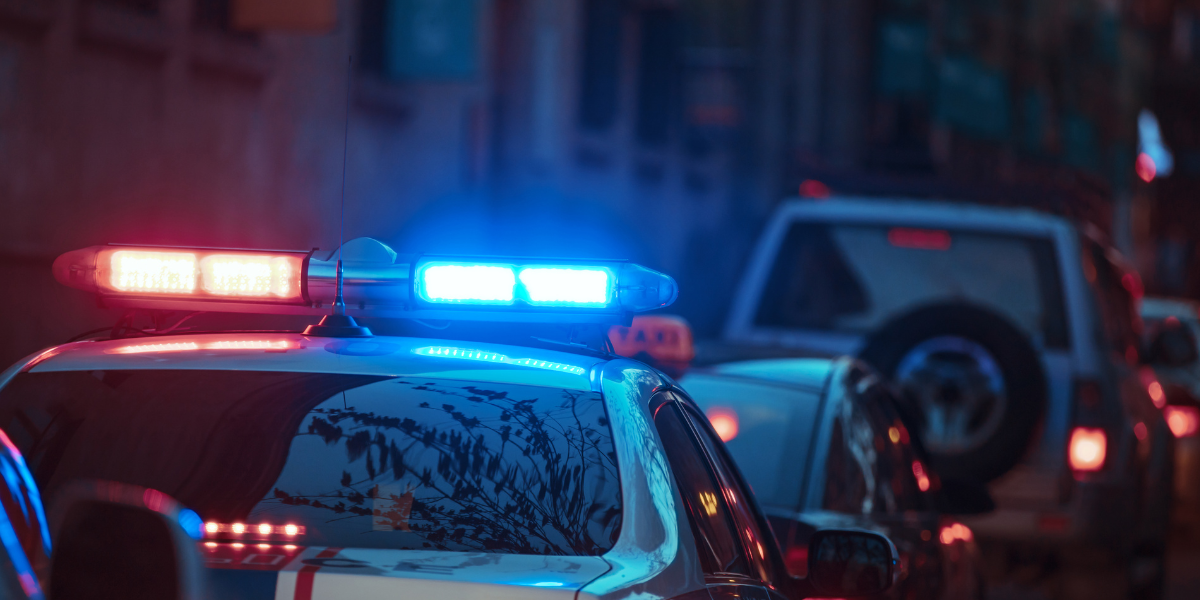Police car attending crime scene